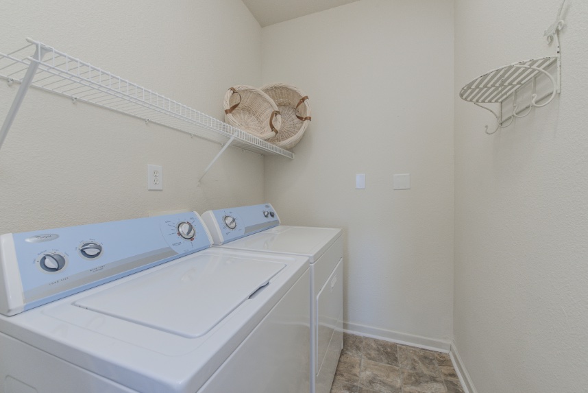 Laundry room with storage space in West Lafayette.